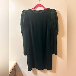 Express vintage style mid length dress. Long sleeved with puffed shoulders.